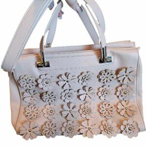 Pink faux leather purse with flower cutouts. EUC